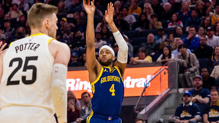 Apr 7, 2024; San Francisco, California, USA;  Golden State Warriors forward Moses Moody (4) shoots a 3-pointer during the first quarter against the Utah Jazz at Chase Center. Mandatory Credit: Bob Kupbens-Imagn Images