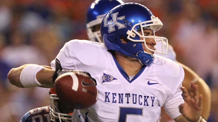 September 25, 2010; Gainesville FL, USA; Florida Gators linebacker Jonathan Bostic (52) sacks Kentucky Wildcats quarterback Mike Hartline (5) during the second half at Ben Hill Griffin Stadium. Florida won 48-14. Mandatory Credit: Kim Klement-Imagn Images
