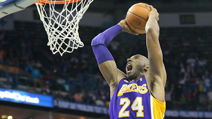 Mar 6, 2013; New Orleans, LA, USA; Los Angeles Lakers guard Kobe Bryant (24) dunks the ball against the New Orleans Hornets during the end of the fourth quarter at the New Orleans Arena. Los Angeles defeated New Orleans 108-102. Mandatory Credit: Crystal LoGiudice-Imagn Images