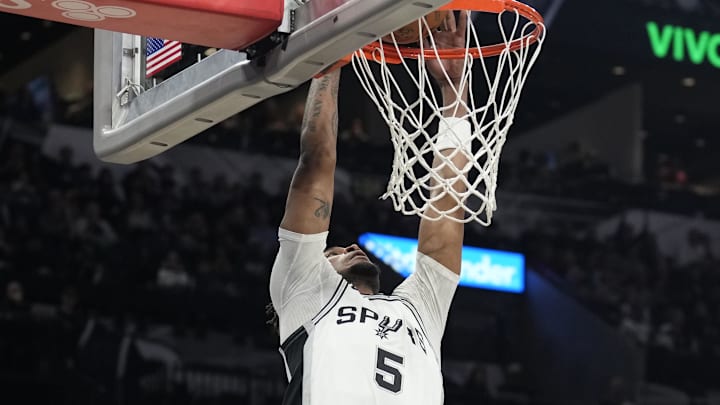 Jan 31, 2025; San Antonio, Texas, USA; San Antonio Spurs guard Stephon Castle (5) dunks during the first half against the Milwaukee Bucks at Frost Bank Center. Mandatory Credit: Scott Wachter-Imagn Images