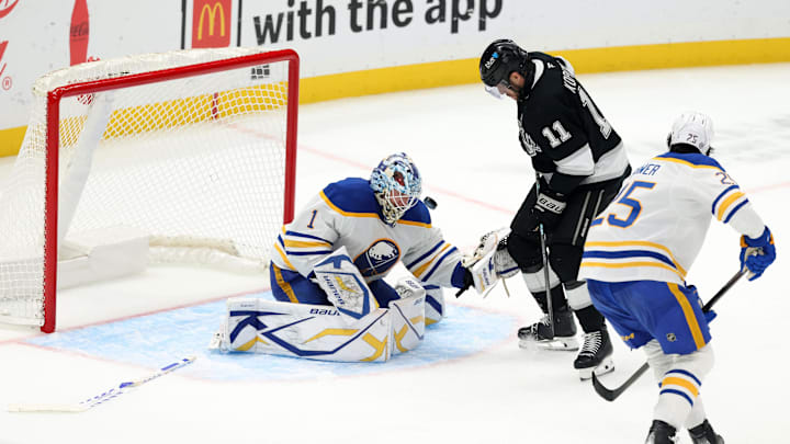Nov 20, 2024; Los Angeles, California, USA;  Buffalo Sabres goaltender Ukko-Pekka Luukkonen (1) defends the goal against Los Angeles Kings center Anze Kopitar (11) during the third period at Crypto.com Arena. Mandatory Credit: Kiyoshi Mio-Imagn Images