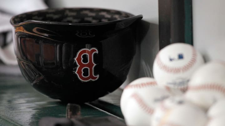 May 24, 2014; St. Petersburg, FL, USA; Boston Red Sox helmet lays in the dugout against the Tampa Bay Rays at Tropicana Field. Mandatory Credit: Kim Klement-Imagn Images