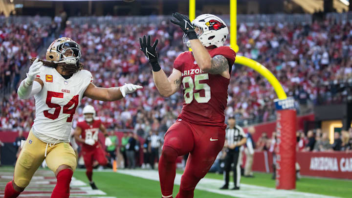 Jan 5, 2025; Glendale, Arizona, USA; Arizona Cardinals tight end Trey McBride (85) catches a touchdown pass against San Francisco 49ers linebacker Fred Warner (54) in the first half at State Farm Stadium. Mandatory Credit: Mark J. Rebilas-Imagn Images Jan 5, 2025; Glendale, Arizona, USA; Arizona Cardinals tight end Trey McBride (85) catches a touchdown pass against San Francisco 49ers linebacker Fred Warner (54) in the first half at State Farm Stadium. Mandatory Credit: Mark J. Rebilas-Imagn Images