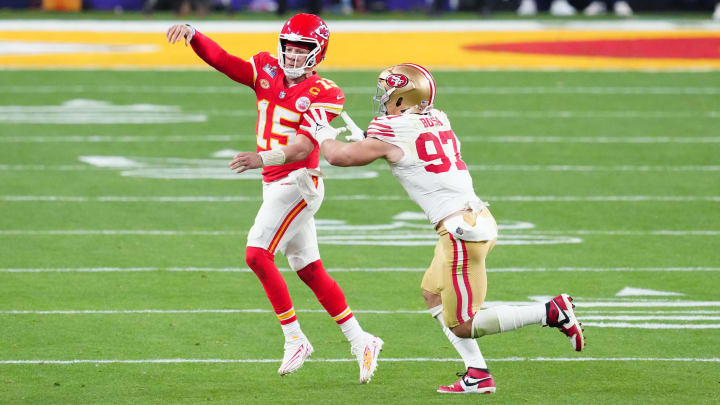 Feb 11, 2024; Paradise, Nevada, USA; Kansas City Chiefs quarterback Patrick Mahomes (15) throws a pass against San Francisco 49ers defensive end Nick Bosa (97) in the second half in Super Bowl LVIII at Allegiant Stadium. Mandatory Credit: Stephen R. Sylvanie-USA TODAY Sports