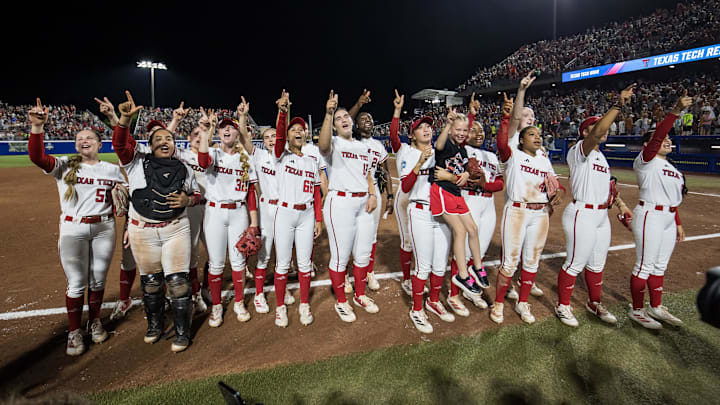 Jun 5, 2025; Oklahoma City, OK, USA;  Texas Tech Red Raiders players cheer towards the fans after defeating the Texas Longhorns in the NCAA Softball Women's College World Series finals at Devon Park. Mandatory Credit: Brett Rojo-Imagn Images