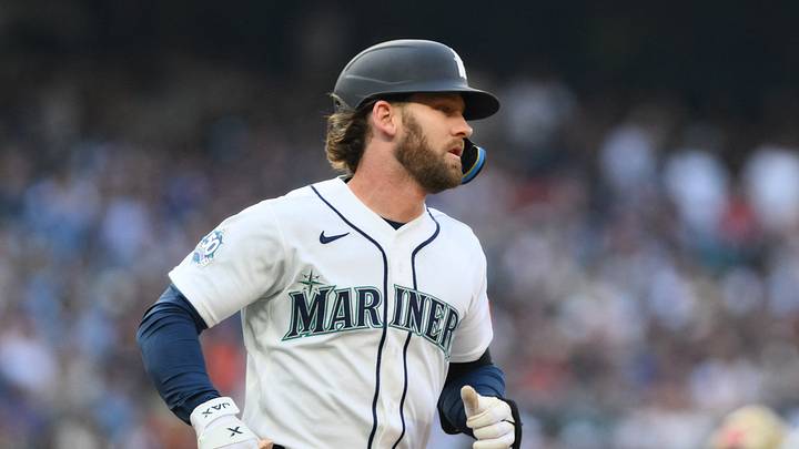 Aug 5, 2026; Seattle, Washington, USA; Seattle Mariners designated hitter Taylor Ward (27) runs towards first base after hitting a single against the Detroit Tigers during the third inning at T-Mobile Park. Mandatory Credit: Steven Bisig-Imagn Images