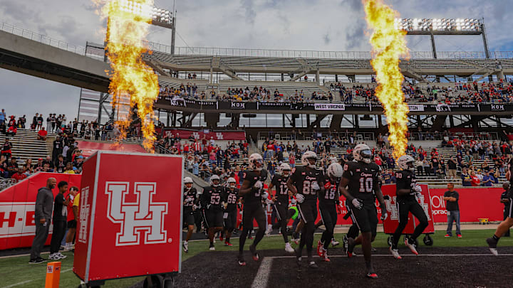 The Houston Cougars run out onto the field before playing against the West Virginia Mountaineers at TDECU Stadium. 