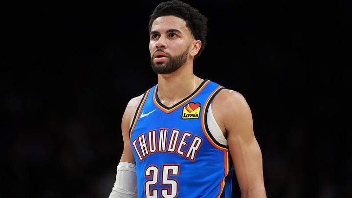 Jan 4, 2026; Phoenix, Arizona, USA; Oklahoma City Thunder guard Ajay Mitchell (25) against the Phoenix Suns at Mortgage Matchup Center. Mandatory Credit: Mark J. Rebilas-Imagn Images