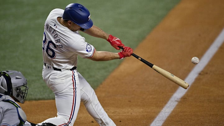 Sep 17, 2024; Arlington, Texas, USA; Texas Rangers left fielder Wyatt Langford (36) hits a ground run double against the Toronto Blue Jays during the first inning at Globe Life Field. | Jerome Miron-Imagn Images