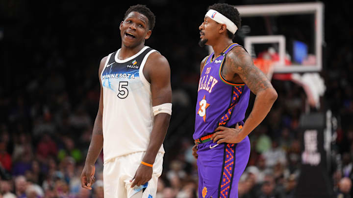Minnesota Timberwolves guard Anthony Edwards (5) and Phoenix Suns guard Bradley Beal talk during the second half at Footprint Center in Phoenix on March 2, 2025.