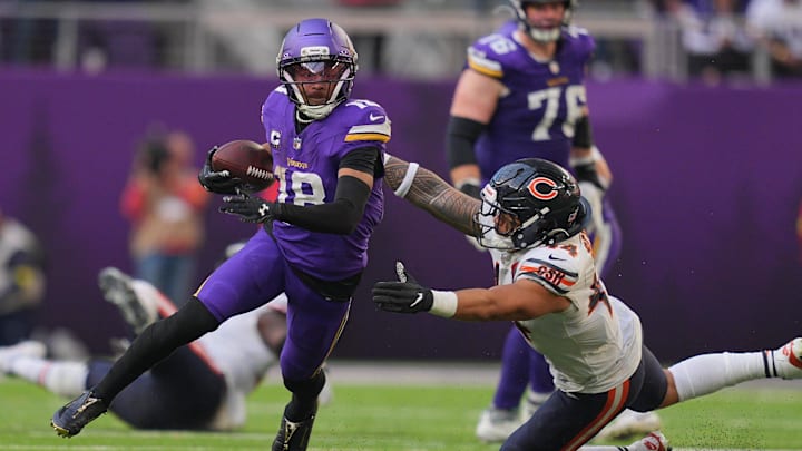 Nov 16, 2025; Minneapolis, Minnesota, USA; Minnesota Vikings wide receiver Justin Jefferson (18) runs for a gain past Chicago Bears linebacker Noah Sewell (44) during the fourth quarter at U.S. Bank Stadium.
