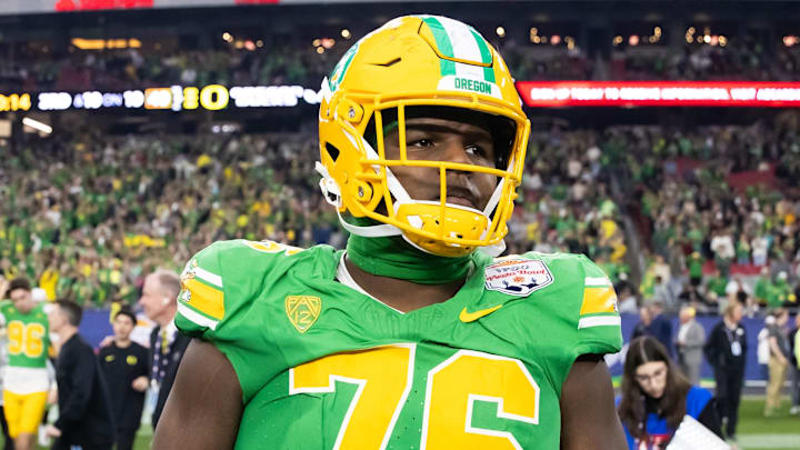 Jan 1, 2024; Glendale, AZ, USA; Oregon Ducks offensive lineman Josh Conerly Jr. (76) against the Liberty Flames during the 2024 Fiesta Bowl at State Farm Stadium. Mandatory Credit: Mark J. Rebilas-Imagn Images Jan 1, 2024; Glendale, AZ, USA; Oregon Ducks offensive lineman Josh Conerly Jr. (76) against the Liberty Flames during the 2024 Fiesta Bowl at State Farm Stadium. Mandatory Credit: Mark J. Rebilas-Imagn Images