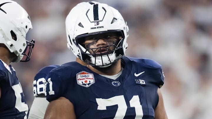 Dec 31, 2024; Glendale, AZ, USA; Penn State Nittany Lions offensive lineman Olaivavega Ioane (71) against the Boise State Broncos during the Fiesta Bowl at State Farm Stadium. Mandatory Credit: Mark J. Rebilas-Imagn Images