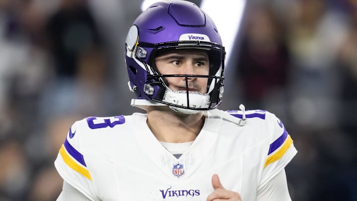 Jan 13, 2025; Glendale, AZ, USA; Minnesota Vikings quarterback Daniel Jones (13) against the Los Angeles Rams during an NFC wild card game at State Farm Stadium. Mandatory Credit: Mark J. Rebilas-Imagn Images
