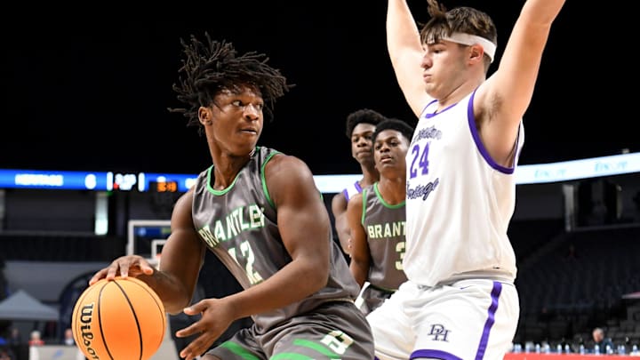 Brantley forward Kedrick Brown (12) is guarded by Decatur Heritage forward Brayden Kyle (24) during the state semifinal game Monday, Feb. 28, 2022, at Legacy Arena in Birmingham, Alabama.

Brantley Vs Decatur Heritage Ahsaa State Semifinal