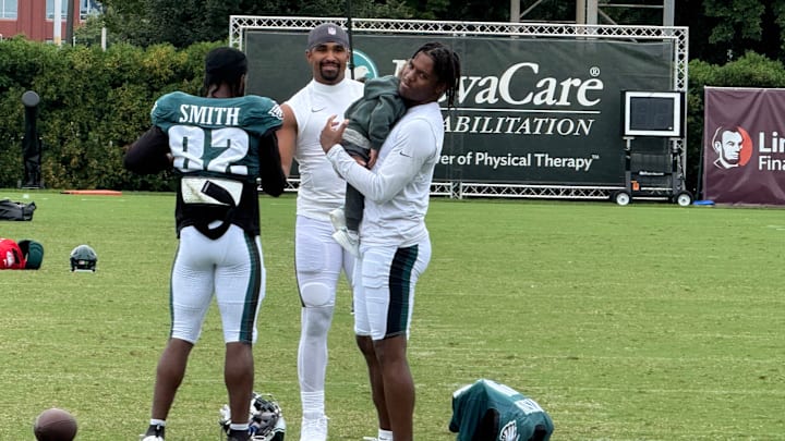 Eagles receivers Ainias Smith (left) and Jahan Dotson (right) got some extra work in after practice with quarterback Jalen Hurts on Day 7 of training camp. Eagles receivers Ainias Smith (left) and Jahan Dotson (right) got some extra work in after practice with quarterback Jalen Hurts on Day 7 of training camp.