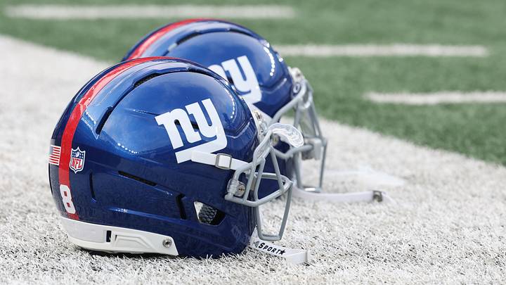 New York Giants helmets rest on the field before the preseason game against the New York Jets at MetLife Stadium. New York Giants helmets rest on the field before the preseason game against the New York Jets at MetLife Stadium.