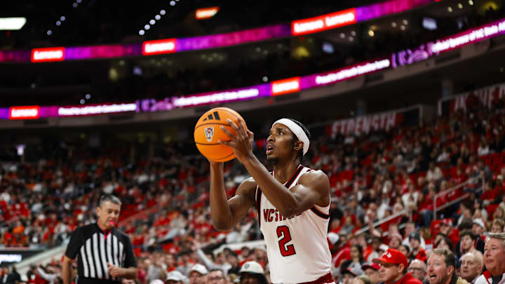 Jan 27, 2026; Raleigh, North Carolina, USA; NC State Wolfpack guard Jr. Paul McNeil (2) shoots a three pointer during the first half of the game against the Syracuse Orange at Lenovo Center. 