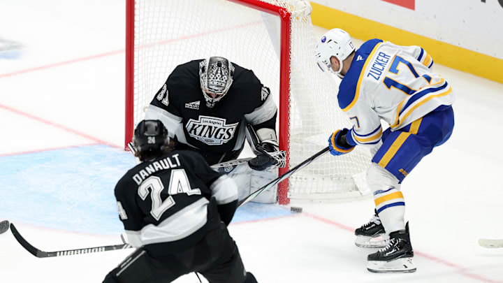 Nov 20, 2024; Los Angeles, California, USA;  Los Angeles Kings goaltender David Rittich (31) defends the goal against Buffalo Sabres left wing Jason Zucker (17) during the third period at Crypto.com Arena. Mandatory Credit: Kiyoshi Mio-Imagn Images