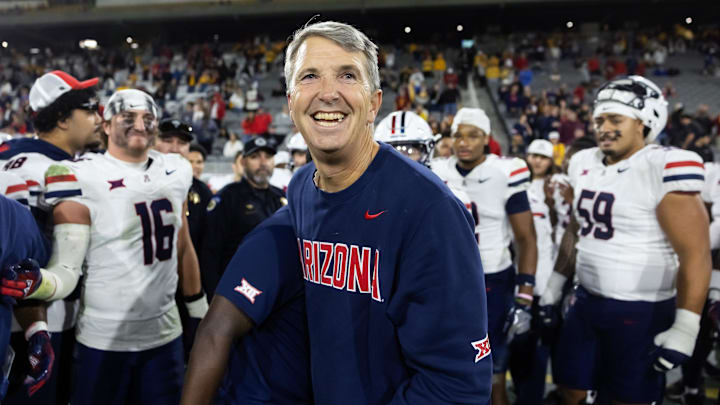 Nov 28, 2025; Tempe, Arizona, USA; Arizona Wildcats head coach Brent Brennan celebrates against the Arizona State Sun Devils during the 99th Territorial Cup at Mountain America Stadium. Mandatory Credit: Mark J. Rebilas-Imagn Images