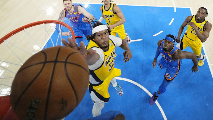 Jun 22, 2025; Oklahoma City, Oklahoma, USA; Indiana Pacers center Myles Turner (33) reaches for the ball against the Oklahoma City Thunder during the first half of game seven of the 2025 NBA Finals at Paycom Center. Mandatory Credit: Kyle Terada-Imagn Images
