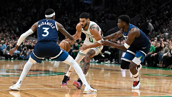 Nov 24, 2024; Boston, Massachusetts, USA; Boston Celtics forward Jayson Tatum (0) tries to drive through Minnesota Timberwolves forward Jaden McDaniels (3) during the first half at TD Garden. Nov 24, 2024; Boston, Massachusetts, USA; Boston Celtics forward Jayson Tatum (0) tries to drive through Minnesota Timberwolves forward Jaden McDaniels (3) during the first half at TD Garden.