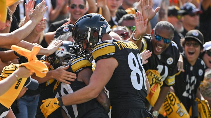 Sep 22, 2024; Pittsburgh, Pennsylvania, USA; Pittsburgh Steelers wide receiver Calvin Austin III (19) celebrates a touchdown with tight end Pat Freiermuth (88) during the fourth quarter against the Los Angeles Chargers  at Acrisure Stadium. Mandatory Credit: Barry Reeger-Imagn Images