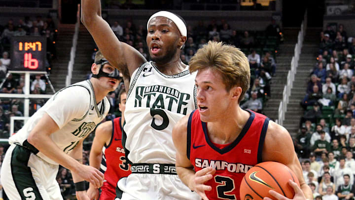 Nov 19, 2024; East Lansing, Michigan, USA; Samford Bulldogs guard Lukas Walls (2) drives to the basket against the Michigan State Spartans during the first half at Jack Breslin Student Events Center. Mandatory Credit: Dale Young-Imagn Images