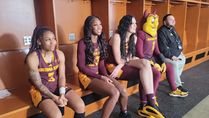 Arizona State women's basketball players Tyi Skinner (from left), Jalyn Brown and Kennedy Basham sit with ASU mascot Sparky at Big 12 Media Day in October 2024. Arizona State women's basketball players Tyi Skinner (from left), Jalyn Brown and Kennedy Basham sit with ASU mascot Sparky at Big 12 Media Day in October 2024.