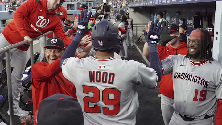 Jun 21, 2025; Los Angeles, California, USA; Washington Nationals outfielder James Wood (29) celebrates with teammates after scoring a home run in the fourth inning against the Los Angeles Dodgers at Dodger Stadium. 
