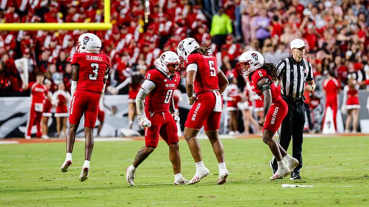 Sep 26, 2026; Raleigh, North Carolina, USA; NC State Wolfpack defensive back Tristan Teasdell (3), linebacker Popo Aguirre (0), linebacker Harvey Dyson III (5) and safety King Mack (4) celebrate during the first half of the game against App State Mountaineers at Carter-Finley Stadium. Mandatory Credit: Jaylynn Nash-Imagn Images Sep 26, 2026; Raleigh, North Carolina, USA; NC State Wolfpack defensive back Tristan Teasdell (3), linebacker Popo Aguirre (0), linebacker Harvey Dyson III (5) and safety King Mack (4) celebrate during the first half of the game against App State Mountaineers at Carter-Finley Stadium. Mandatory Credit: Jaylynn Nash-Imagn Images