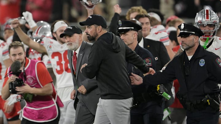 Jan 1, 2025; Pasadena, CA, USA; Ohio State Buckeyes head coach Ryan Day runs on field after defeating the Oregon Ducks in the 2025 Rose Bowl college football quarterfinal game at Rose Bowl Stadium. Jan 1, 2025; Pasadena, CA, USA; Ohio State Buckeyes head coach Ryan Day runs on field after defeating the Oregon Ducks in the 2025 Rose Bowl college football quarterfinal game at Rose Bowl Stadium.