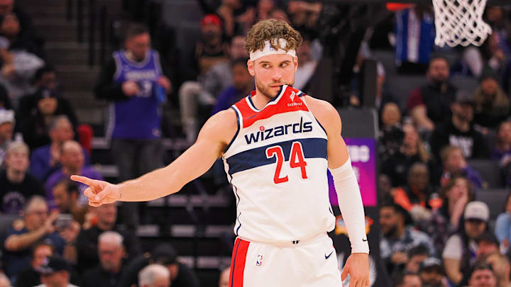 Dec 18, 2023; Sacramento, California, USA; Washington Wizards forward Corey Kispert (24) with part of his jersey in his mouth between plays against the Sacramento Kings during the third quarter at Golden 1 Center. Mandatory Credit: Kelley L Cox-Imagn Images Dec 18, 2023; Sacramento, California, USA; Washington Wizards forward Corey Kispert (24) with part of his jersey in his mouth between plays against the Sacramento Kings during the third quarter at Golden 1 Center. Mandatory Credit: Kelley L Cox-Imagn Images