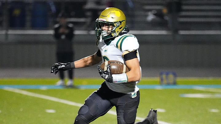 Racine Case's Michael Farr (6) sprints downfield during a WIAA Level 2 playoff game at Mukwonago on Friday, Nov. 1, 2024.
