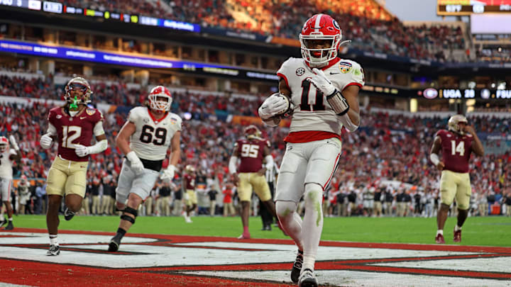 Dec 30, 2023; Miami Gardens, FL, USA; Georgia Bulldogs linebacker Jalon Walker (11) reacts after scoring a touchdown against the Florida State Seminoles during the first half in the 2023 Orange Bowl at Hard Rock Stadium. Mandatory Credit: Nathan Ray Seebeck-Imagn Images Dec 30, 2023; Miami Gardens, FL, USA; Georgia Bulldogs linebacker Jalon Walker (11) reacts after scoring a touchdown against the Florida State Seminoles during the first half in the 2023 Orange Bowl at Hard Rock Stadium. Mandatory Credit: Nathan Ray Seebeck-Imagn Images