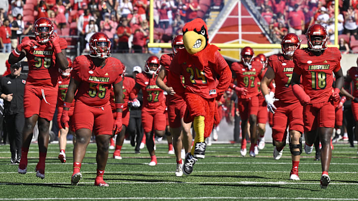 Oct 5, 2024; Louisville, Kentucky, USA; The Louisville Cardinals take the field before the first quarter against the Southern Methodist Mustangs at L&N Federal Credit Union Stadium. Oct 5, 2024; Louisville, Kentucky, USA; The Louisville Cardinals take the field before the first quarter against the Southern Methodist Mustangs at L&N Federal Credit Union Stadium.
