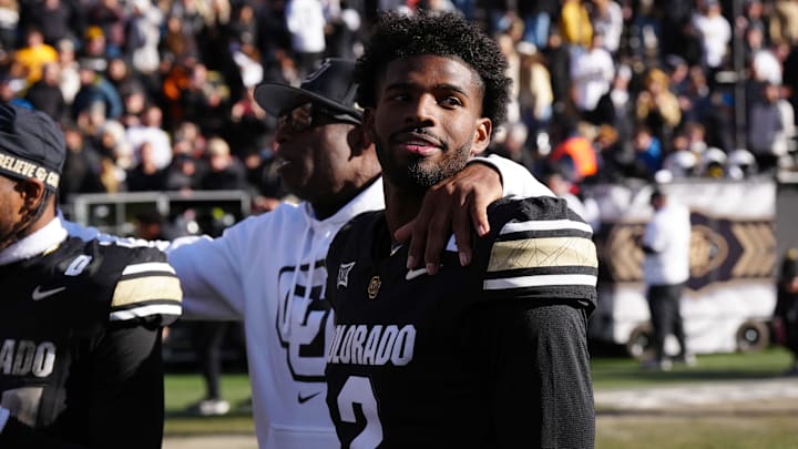 Colorado Buffaloes quarterback Shedeur Sanders and head coach Deion Sanders.