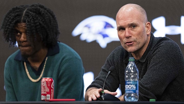 Baltimore Ravens general manager Eric DeCosta answers a question during a press conference alongside quarterback Lamar Jackson.