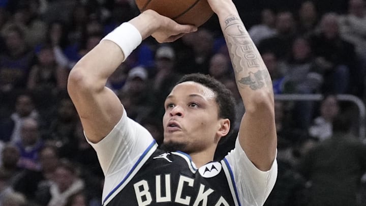 Feb 27, 2026; Milwaukee, Wisconsin, USA; Milwaukee Bucks guard Ryan Rollins (13) shoots the ball against the New York Knicks in the first half at Fiserv Forum. Mandatory Credit: Michael McLoone-Imagn Images