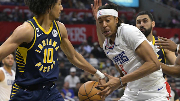 Nov 27, 2022; Los Angeles, California, USA; Los Angeles Clippers center Moses Brown (9) is fouled by Indiana Pacers guard Kendall Brown (10) as he drives to the basket in the second half at Crypto.com Arena. Mandatory Credit: Jayne Kamin-Oncea-Imagn Images