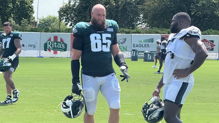 Lane Johnson and Moro Ojomo discuss a drill during Eagles training camp. Lane Johnson and Moro Ojomo discuss a drill during Eagles training camp.