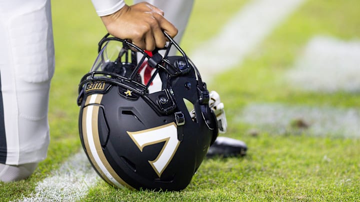 Nov 23, 2024; Baton Rouge, Louisiana, USA; Detailed view of the Vanderbilt Commodores helmet on the turf against the LSU Tigers during the first half at Tiger Stadium. Mandatory Credit: Stephen Lew-Imagn Images Nov 23, 2024; Baton Rouge, Louisiana, USA; Detailed view of the Vanderbilt Commodores helmet on the turf against the LSU Tigers during the first half at Tiger Stadium. Mandatory Credit: Stephen Lew-Imagn Images