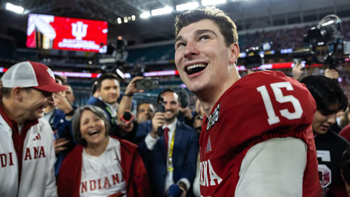 Jan 19, 2026; Miami Gardens, FL, USA; Indiana Hoosiers quarterback Fernando Mendoza (15) celebrates with family members after defeating the Miami Hurricanes in the College Football Playoff National Championship game at Hard Rock Stadium. Mandatory Credit: Mark J. Rebilas-Imagn Images