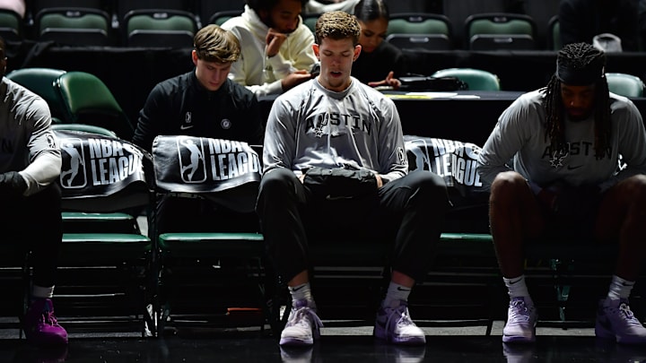 Jan 1, 2024; Cedar Park, Texas, USA; San Antonio Spurs two-way forward Riley Minix (27) sits on the bench prior to a game against the Iowa Wolves on New Year's Day at H-E-B Center.