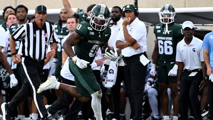 Sep 12, 2026; East Lansing, Michigan, USA; Michigan State Spartans running back Cam Edwards (0) racks up yardage on a long play from scrimmage during the fourth quarter against the Eastern Michigan Eagles at Spartan Stadium. Mandatory Credit: Dale Young-Imagn Images Sep 12, 2026; East Lansing, Michigan, USA; Michigan State Spartans running back Cam Edwards (0) racks up yardage on a long play from scrimmage during the fourth quarter against the Eastern Michigan Eagles at Spartan Stadium. Mandatory Credit: Dale Young-Imagn Images