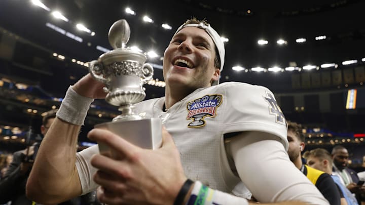 Notre Dame Fighting Irish quarterback Riley Leonard celebrates with fans in the stands after defeating the Georgia Bulldogs in the Sugar Bowl at Caesars Superdome. Notre Dame Fighting Irish quarterback Riley Leonard celebrates with fans in the stands after defeating the Georgia Bulldogs in the Sugar Bowl at Caesars Superdome.