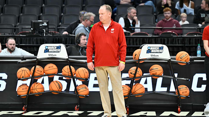 Mar 18, 2026; Portland, OR, USA; Wisconsin Badgers head coach Greg Gard watches warmups during a practice session ahead of the first round of the men's 2026 NCAA Tournament at Moda Center. Mandatory Credit: Craig Strobeck-Imagn Images