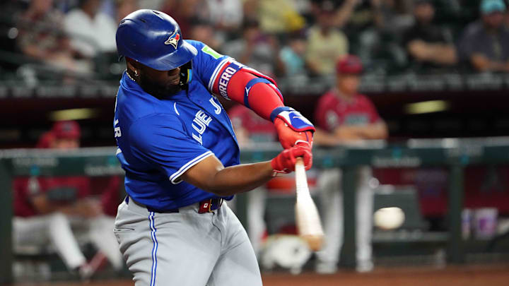 Jul 14, 2024; Phoenix, Arizona, USA; Toronto Blue Jays first base Vladimir Guerrero Jr. (27) hits a double against the Arizona Diamondbacks during the first inning at Chase Field. Mandatory Credit: Joe Camporeale-Imagn Images Jul 14, 2024; Phoenix, Arizona, USA; Toronto Blue Jays first base Vladimir Guerrero Jr. (27) hits a double against the Arizona Diamondbacks during the first inning at Chase Field. Mandatory Credit: Joe Camporeale-Imagn Images