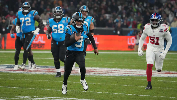 Nov 10, 2024; Munich, Germany; Carolina Panthers quarterback Bryce Young (9) is pursued by New York Giants linebacker Azeez Ojulari (51) on a 24-yard run n the second half during the 2024 NFL Munich Game at Allianz Arena. Mandatory Credit: Kirby Lee-Imagn Images Nov 10, 2024; Munich, Germany; Carolina Panthers quarterback Bryce Young (9) is pursued by New York Giants linebacker Azeez Ojulari (51) on a 24-yard run n the second half during the 2024 NFL Munich Game at Allianz Arena. Mandatory Credit: Kirby Lee-Imagn Images