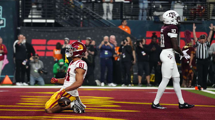 Dec 27, 2024; Las Vegas, NV, USA; iSouthern California Trojans wide receiver Kyle Ford (81) celebrates after scoring on a 7-yard touchdown reception against the Texas A&M Aggies at Allegiant Stadium. Mandatory Credit: Kirby Lee-Imagn Images